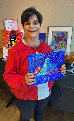 CHOICES participant holding a painting