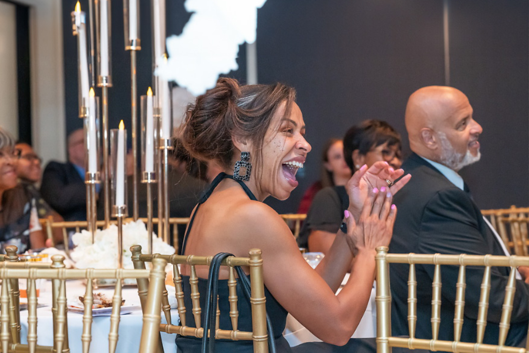 Lady clapping at gala