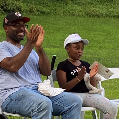 Father and daughter clapping