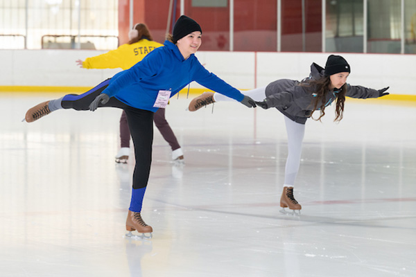 Teens ice skating