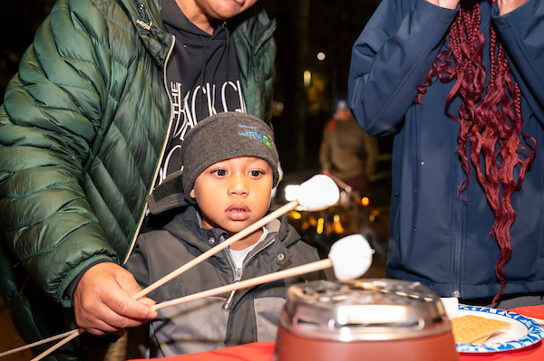 child roasting marshmallows