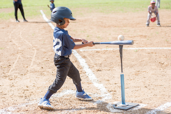 Young Boy Hitting a TeeBall