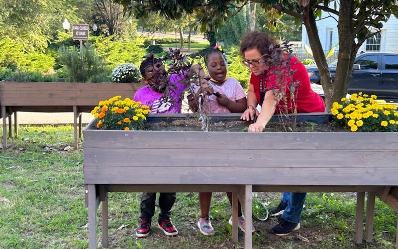 children and instructor tabletop gardening