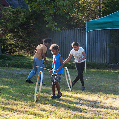 Kids playing games in the grass